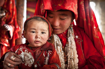 Afghani girl embraces her younger sister