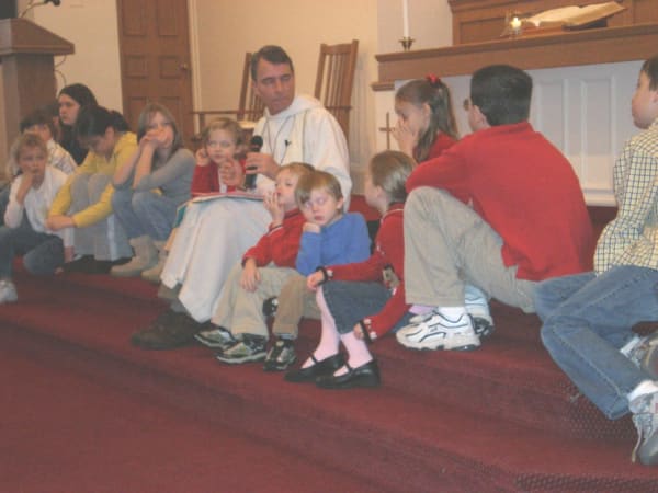 Pastor with young worshippers