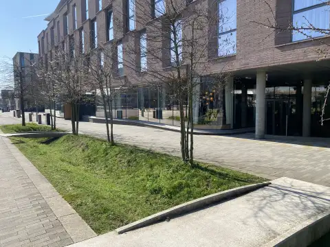 View of the pavement showing the Hyatt Centric next door. 