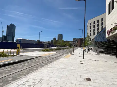 The Bullring is visible in the background with his distinct silver disc exterior