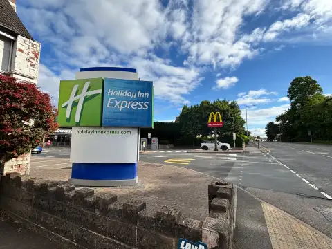 The Holiday Inn sign as seen from the A38