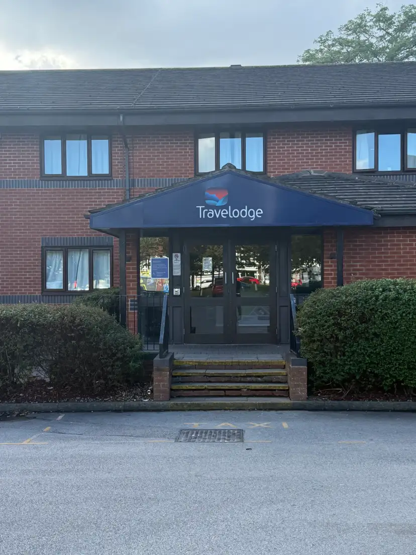 Travelodge Birmingham Yardley exterior viewed from Steyning Road car park approach, showing hotel frontage set back from the A45 dual carriageway