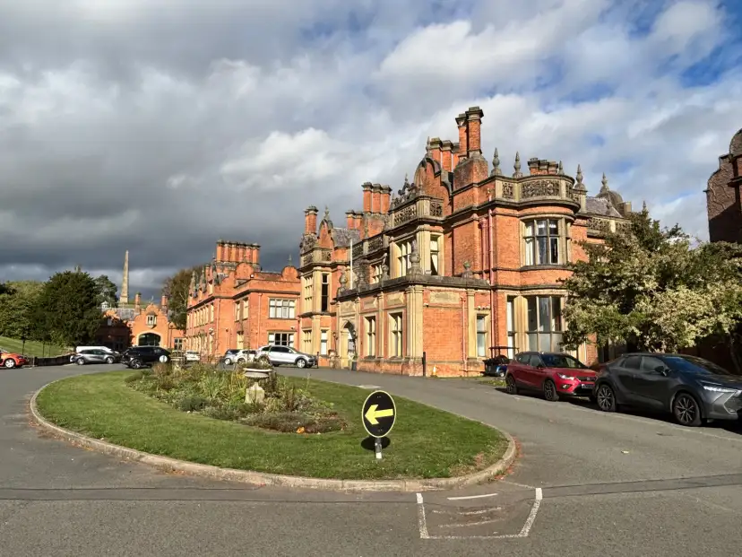 The Welcombe Hotel exterior showing the Neo-Jacobean manor house facade approached via a half-mile tree-lined driveway within private estate grounds in Stratford-upon-Avon