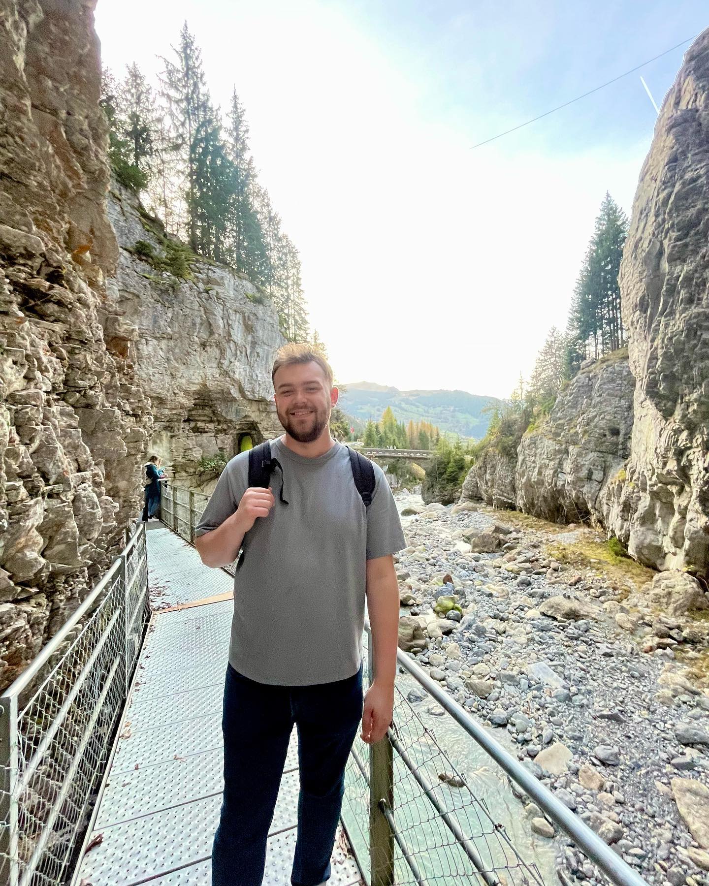 Matt hiking by rocky river