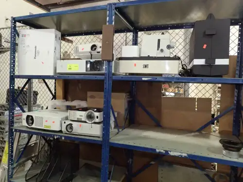 Assorted Projectors And Projector Screens
