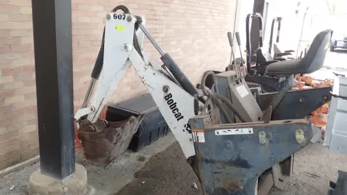 (1) Model 607 Bobcat Backhoe Attachment  (Grounds Dept.)