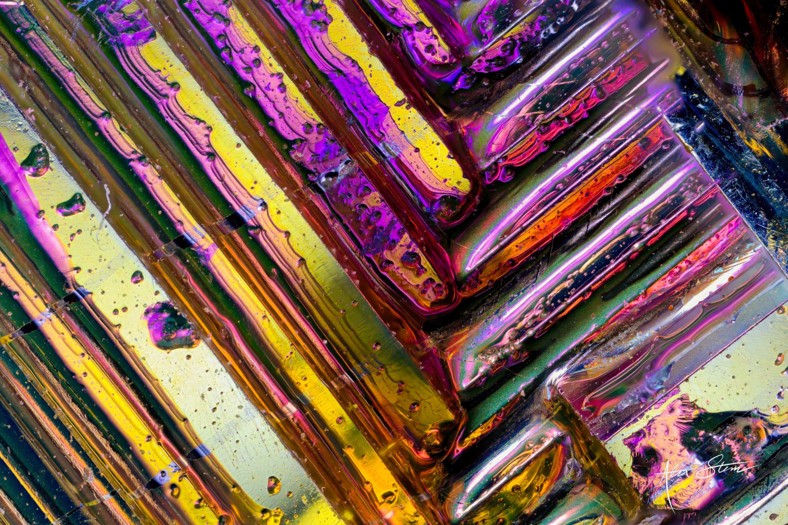 Vibrant, iridescent crystalline structures fill the foreground, with a darker, textured background.