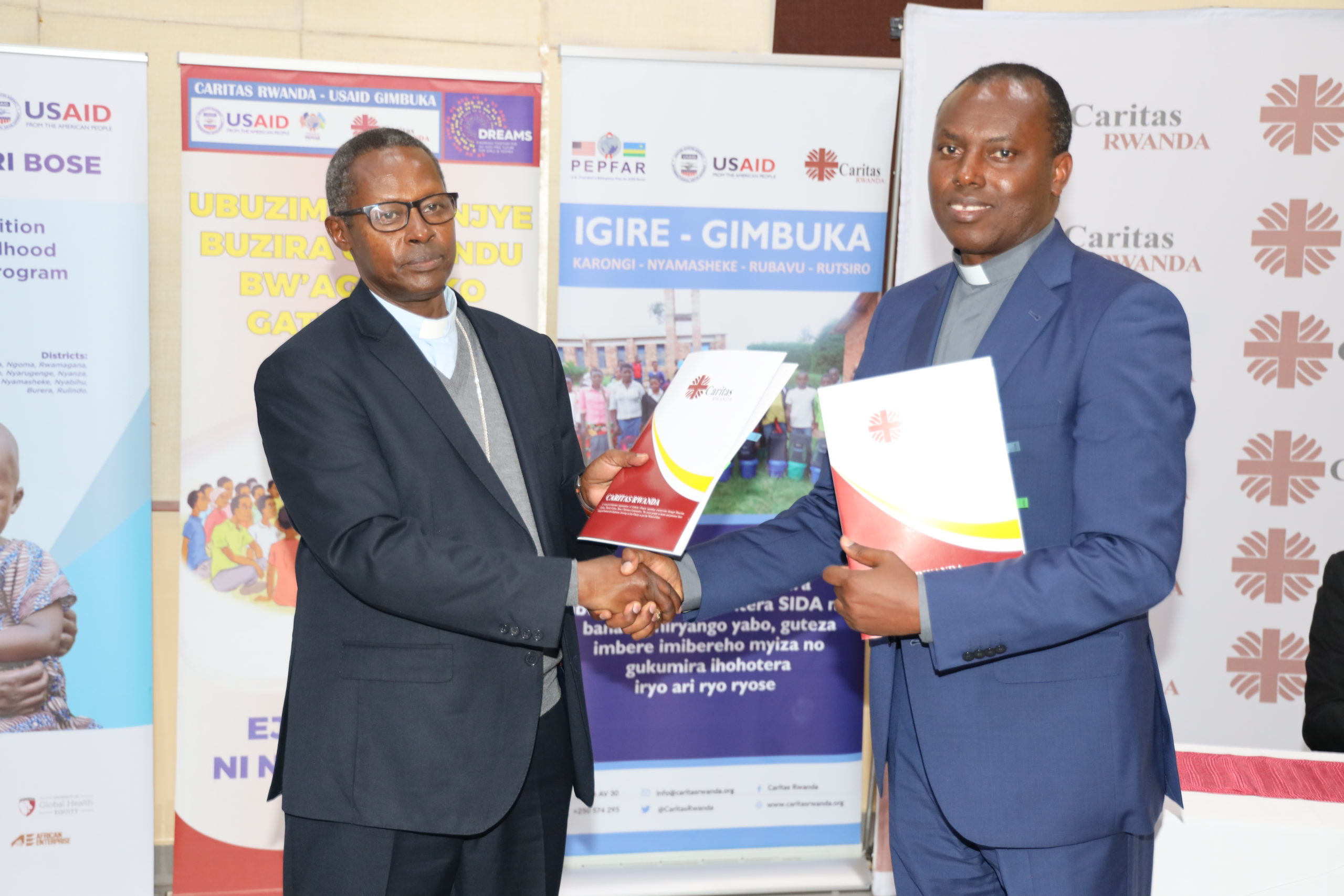 Handover ceremony between the outgoing Secretary General of Caritas Rwanda and the new Secretary General