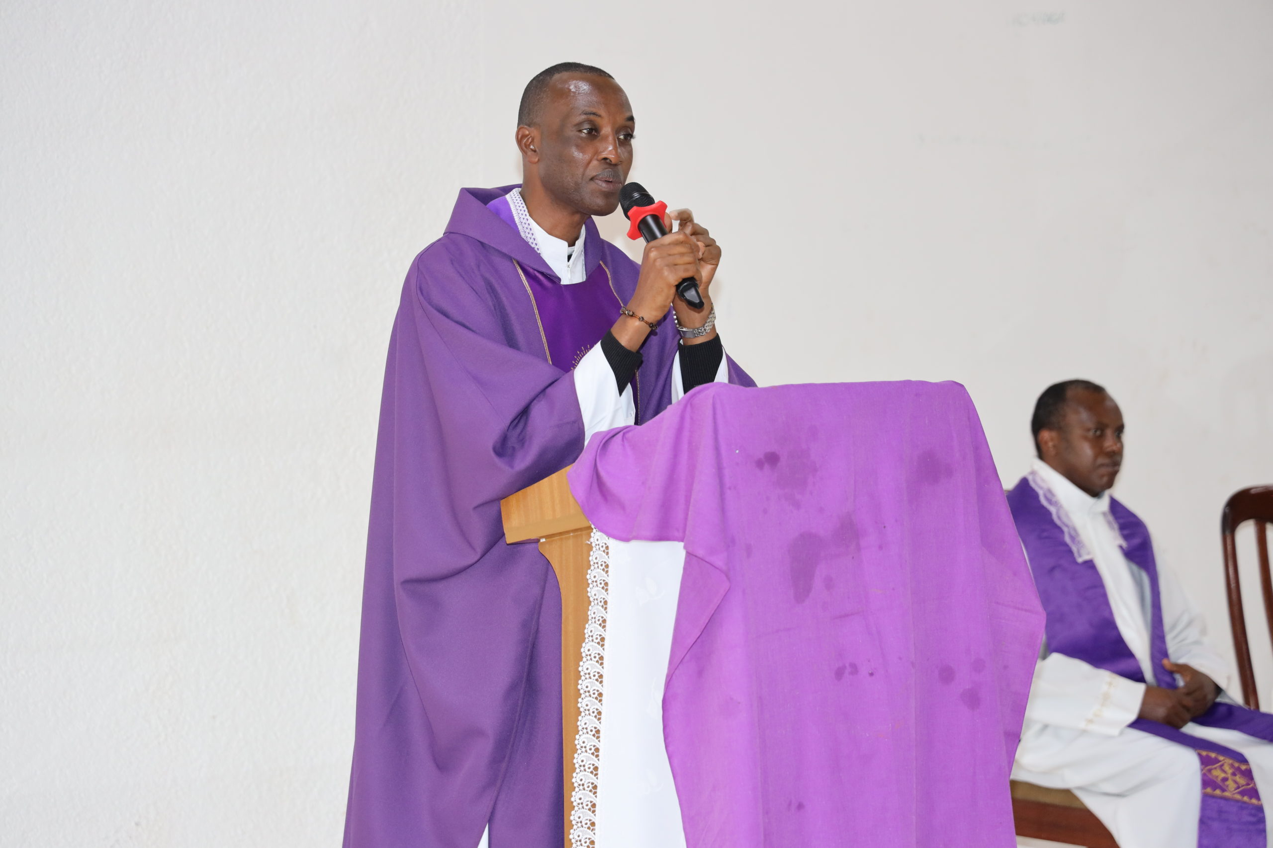 Father Emmanuel Mugiraneza, delivering his predication.