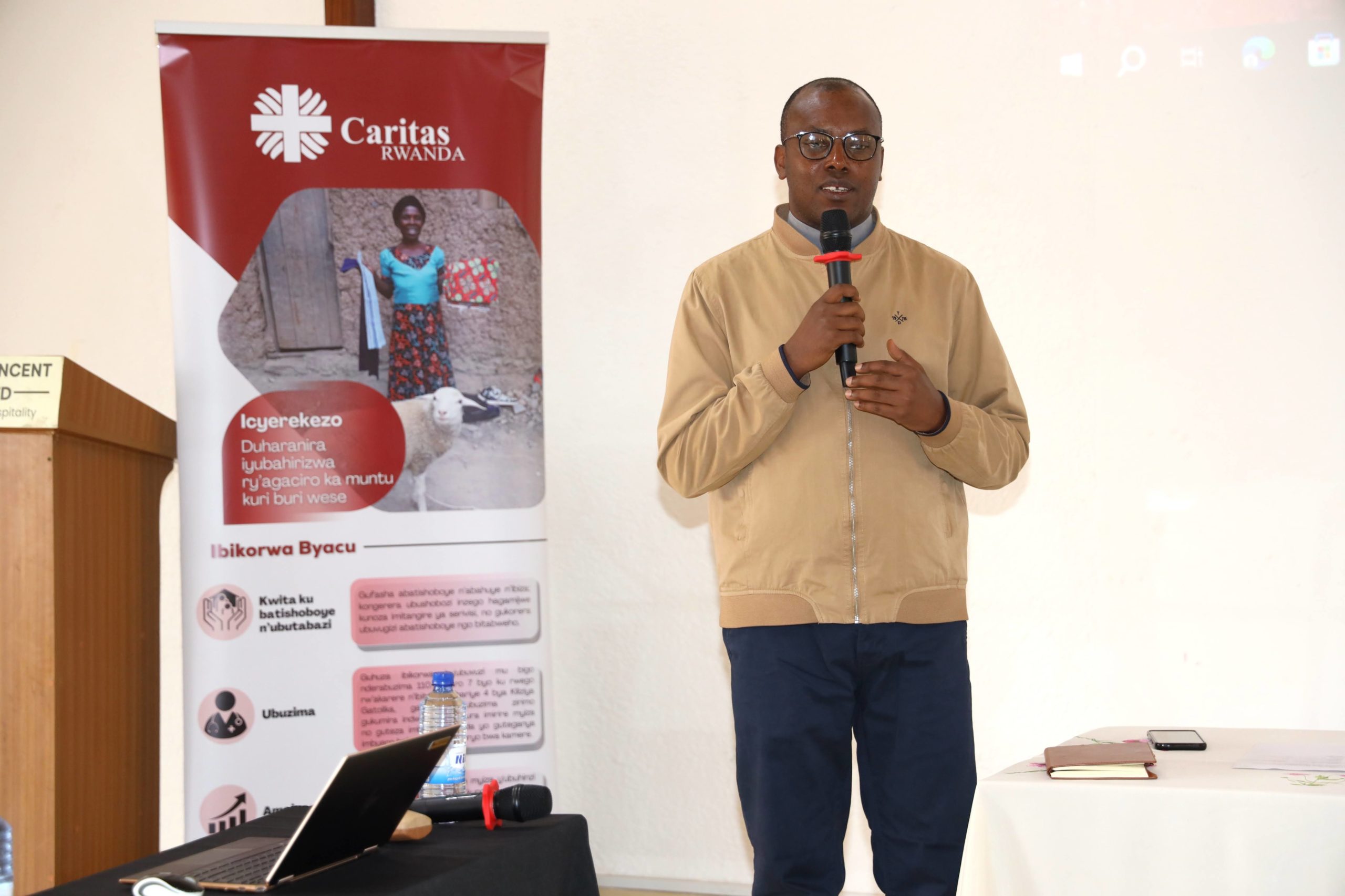 Father Oscar Kagimbura, Secretary General of Caritas Rwanda, delivering his opening remarks.