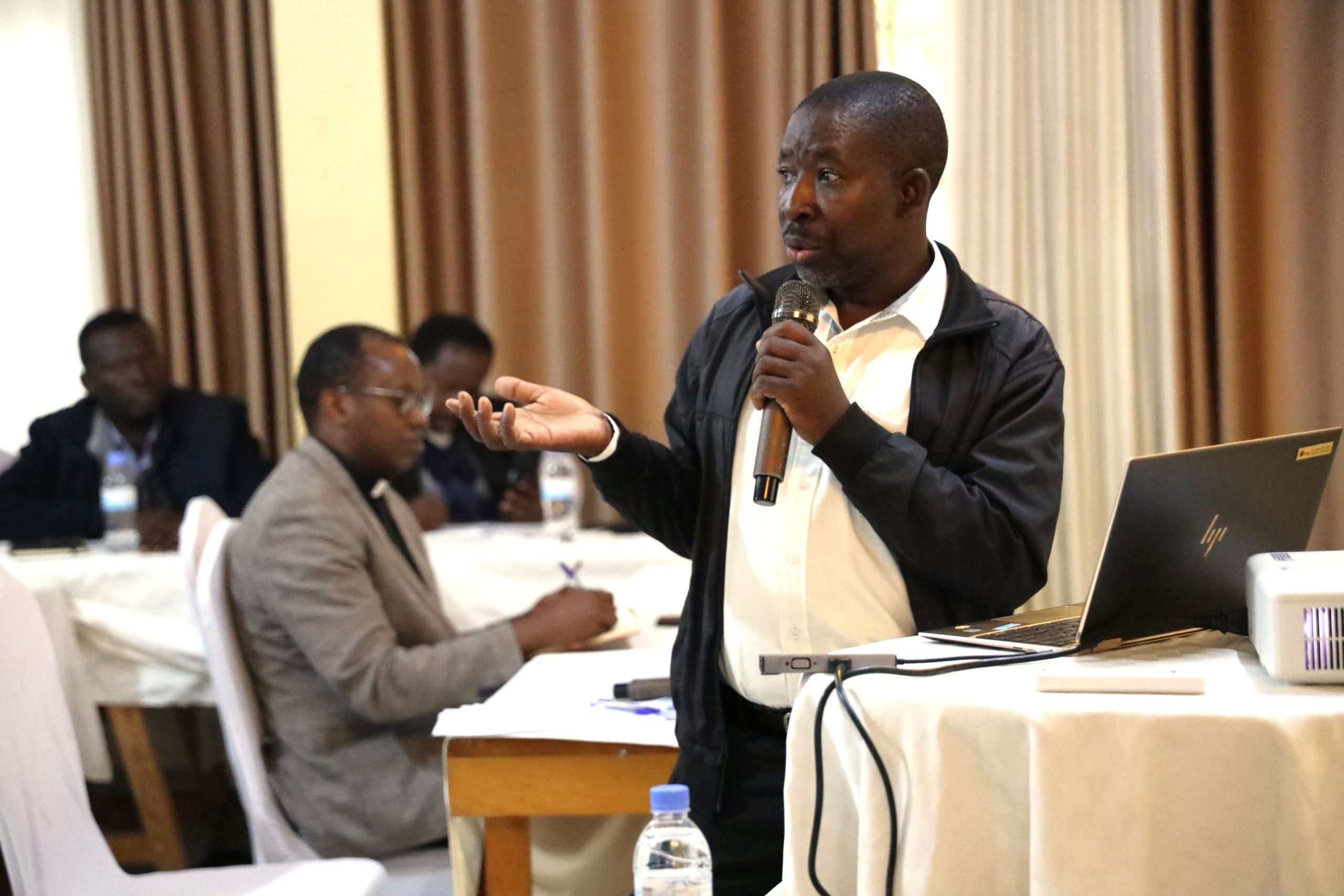 Bazasekabaruhe Jean Damascène, responsible for the Social Welfare Department in Caritas Ruhengeri, presenting the progress of contributions for the Charity and Mercy Month.