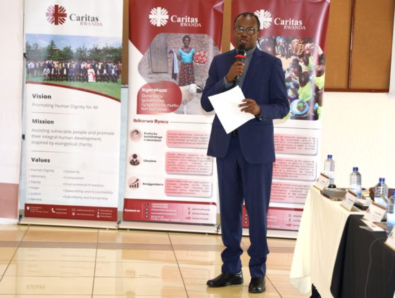 Father Oscar Kagimbura, the Secretary General of Caritas Rwanda presenting the agenda.