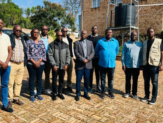 Coordinators of the Development Department of the diocesan Caritas and a team from Caritas Rwanda with Bishop Jean Bosco Ntagungira of the Diocese of Butare.