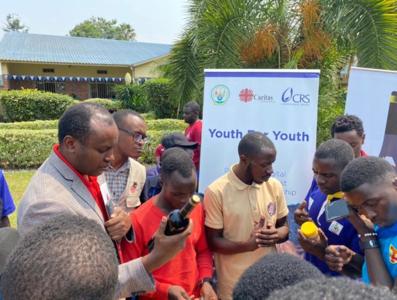 Father Oscar Kagimbura, the Secretary-General of Caritas Rwanda, visiting the stands at Mini Exhibition of Y4Y & GKN Participants. PHOTO by: Olivier Ndamukunda / Caritas Rwanda.