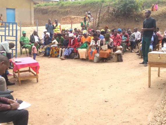 Visitors interacting with parents about inclusive Nurturing Care services and their contributions and commitments to sustaining these services at Gatovu Nurturing Care Hub.
