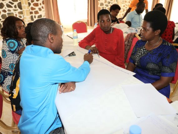 The Health Care Workers working in group to elaborate the field visit schedule.