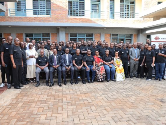 A group photo of the Caritas Rwanda’s management team and staff, the family members of the former Caritas Rwanda staff perished in the 1994 Genocide against the Tutsi, and other guests.