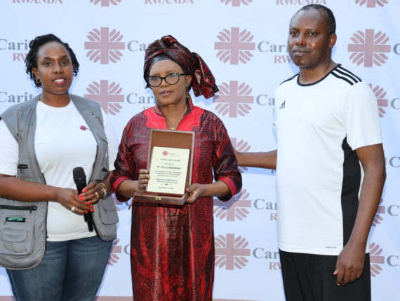 Mrs. Nduwamungu Thérèse received an appreciation award from Caritas Rwanda for her outstanding work during 18 years of service.