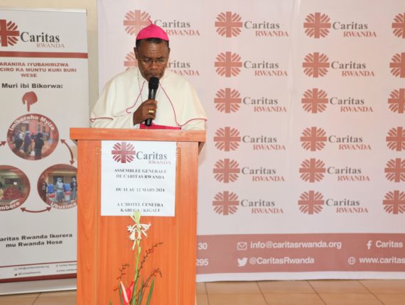 Bishop Anaclet Mwumvaneza, President of Caritas Rwanda, delivering the opening speech at the General Assembly of Caritas Rwanda.