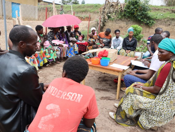 Parents gathering in a Saving and Internal Lending Community group.