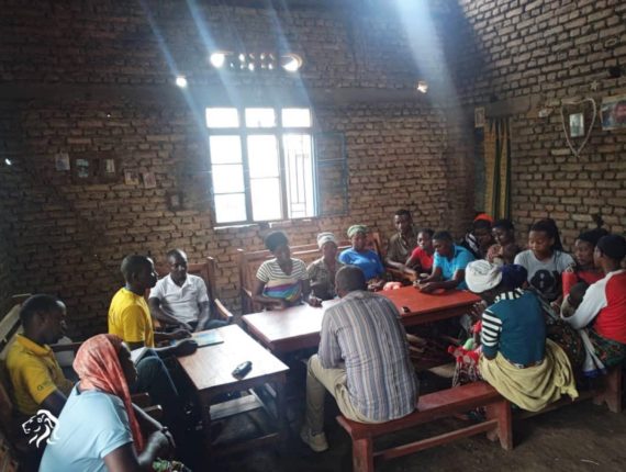 Members one of the VSLA with Caritas Rwanda’s employees (Development Department).