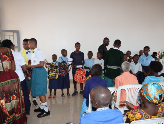 Students from Les Hirondelles de Don Bosco school offered school materials to the students from Rugarama Primary School.