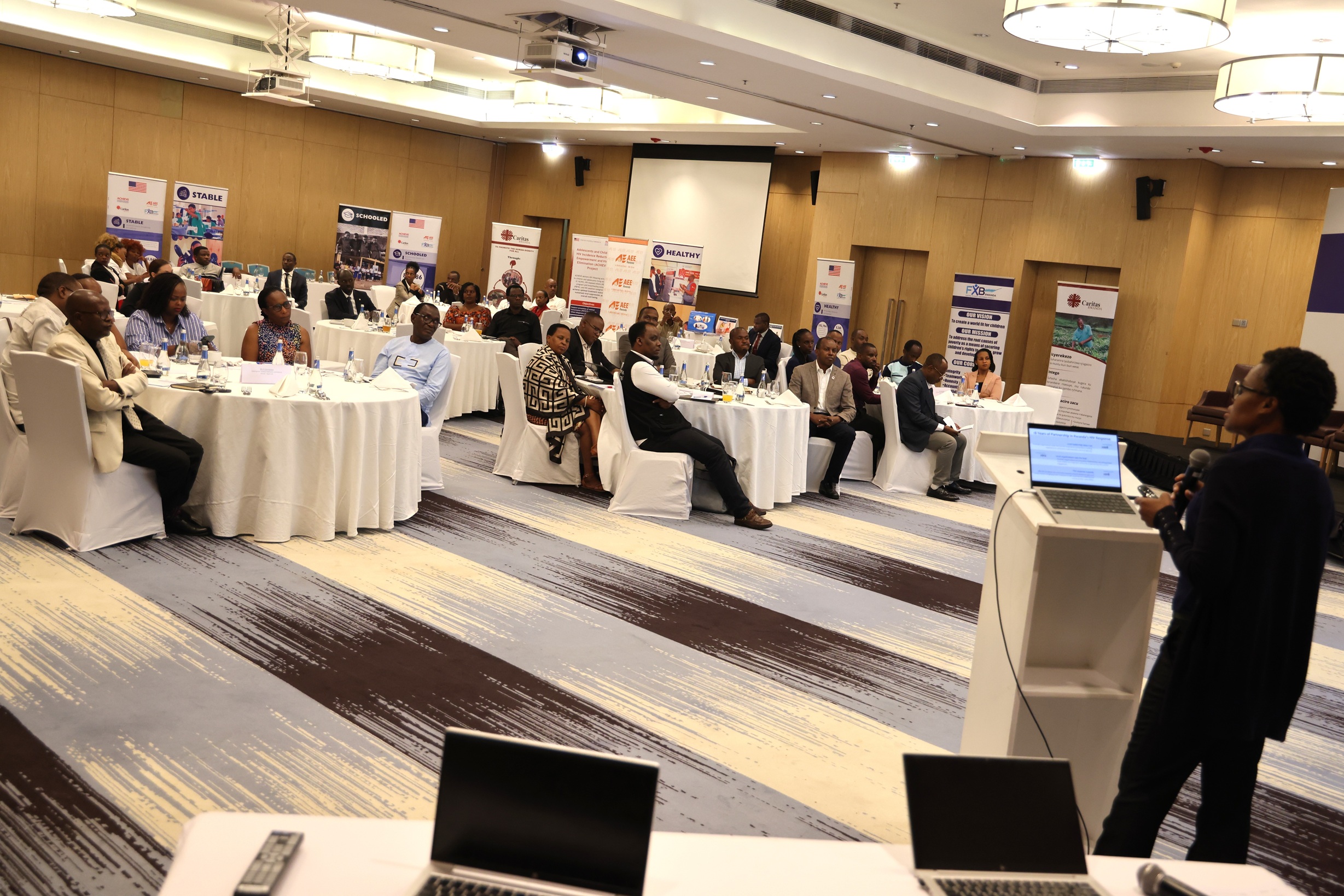Partners and stakeholders who attended the PACT/ACHIEVE and IGIRE Implementing Partners’ Legacy and Learning Event.