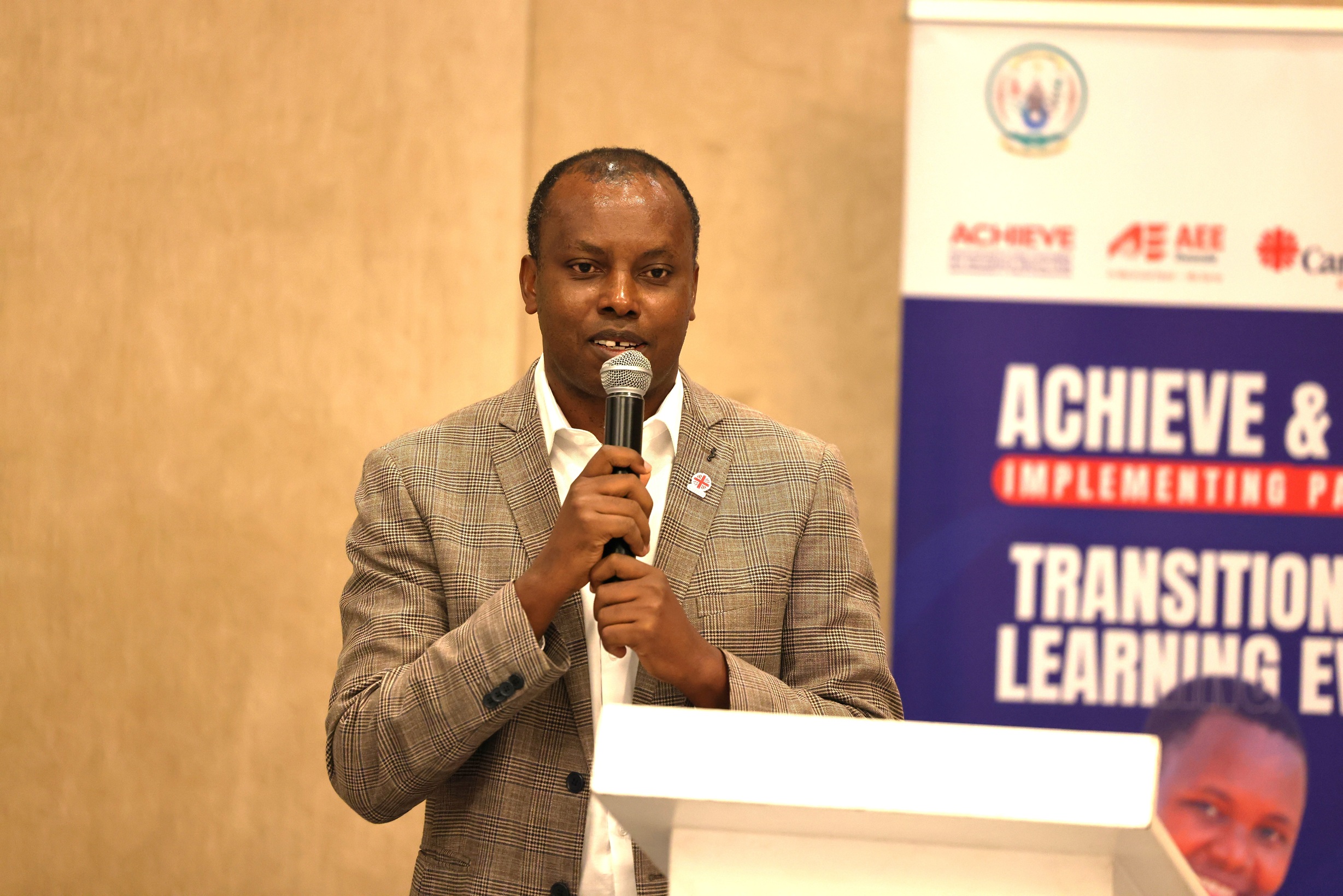 Father Oscar Kagimbura, Secretary General of Caritas Rwanda, delivering his speech as the Guest of Honor during this event.