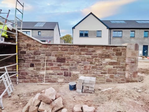 Stone wall construction in progress at Sunnyside Estate - Masowa & Son