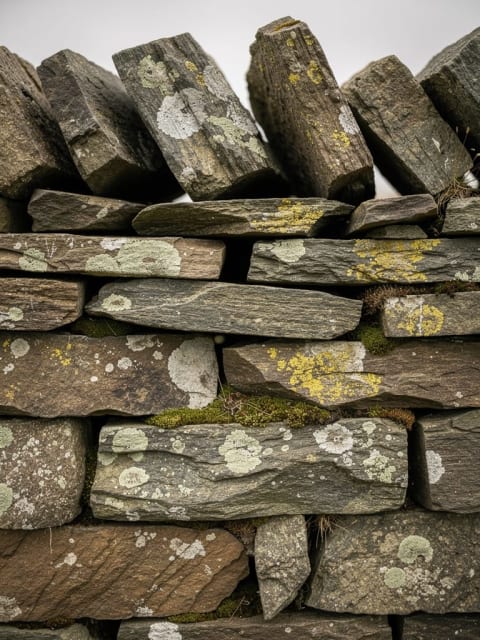 Traditional dry stone dyke detail showing interlocking stones without mortar