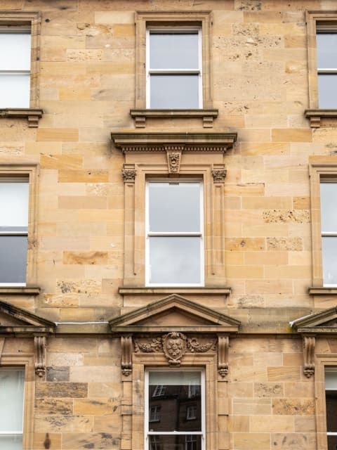 Restored historic stonework showing seamless repairs on a period building