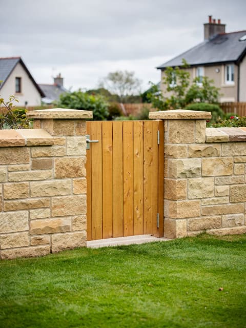 Natural sandstone boundary wall construction detail, Angus