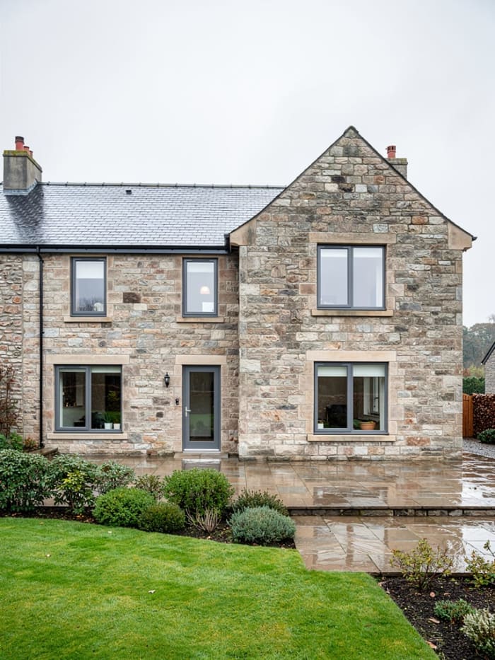 Stone extension matching original building stonework