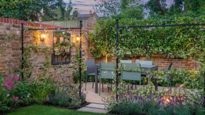 Montrose Landscapes in Surrey - Website Image showing gorgeous garden dining image at dusk in Surrey.
