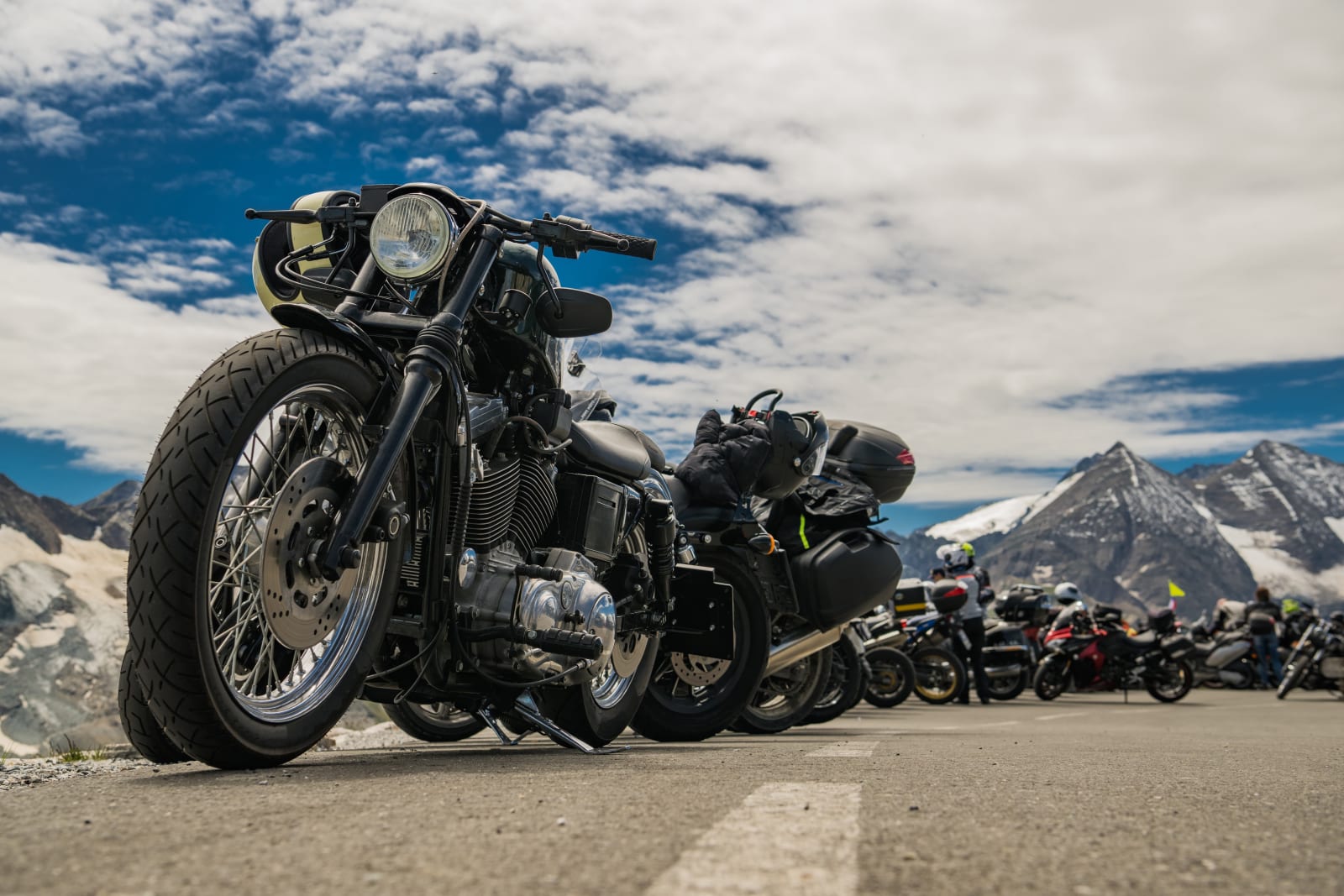 Motorcycles parked along road in mountain scenery at Chele La