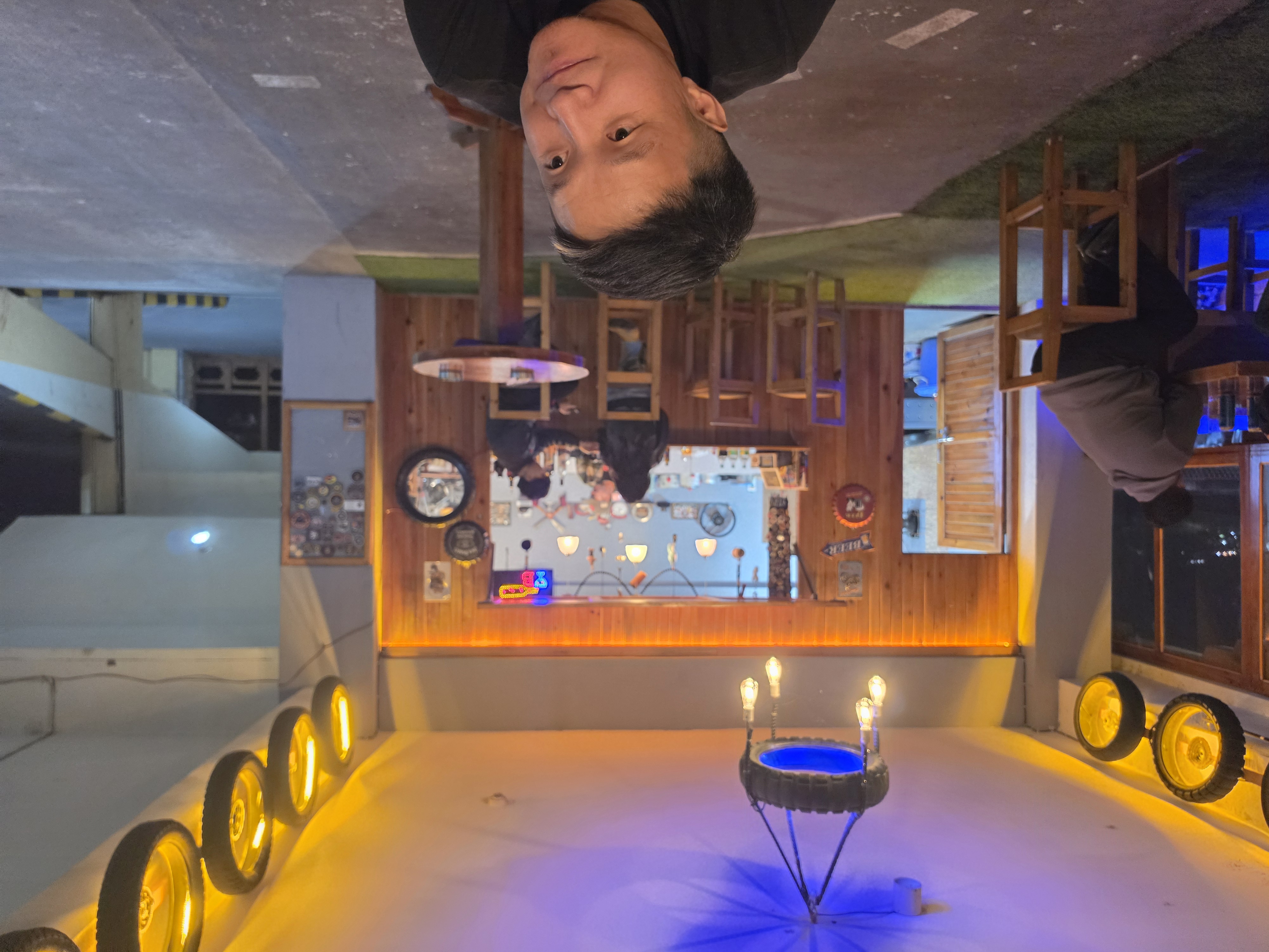 Golden wheel halo canopy over the Handle Bar counter