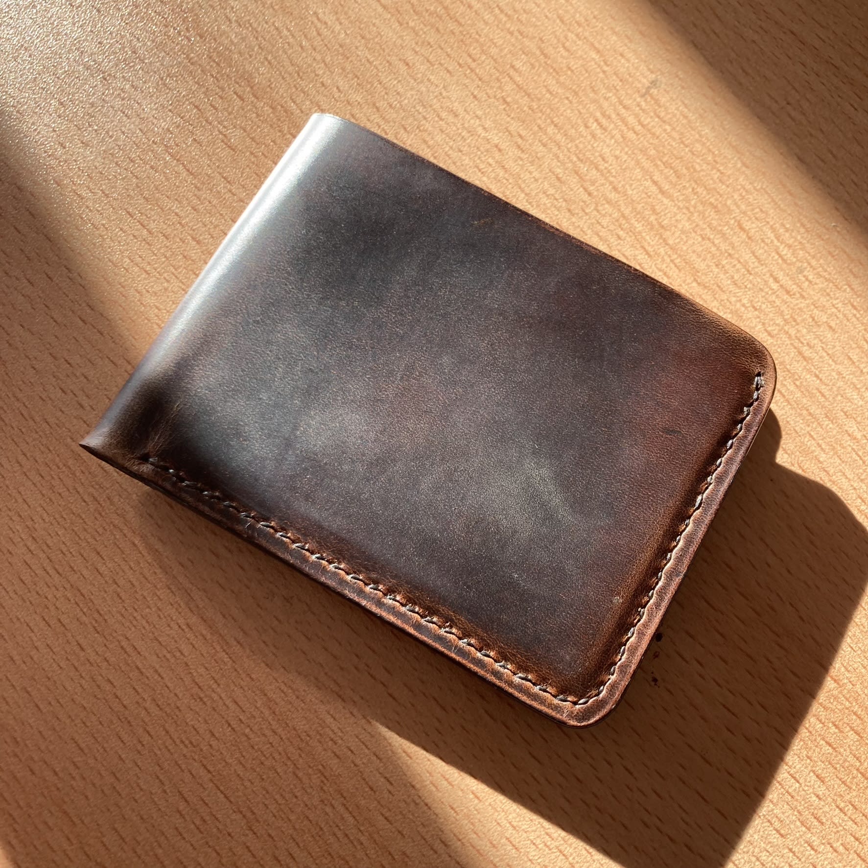 Bifold wallet in tan vegetable-tanned leather