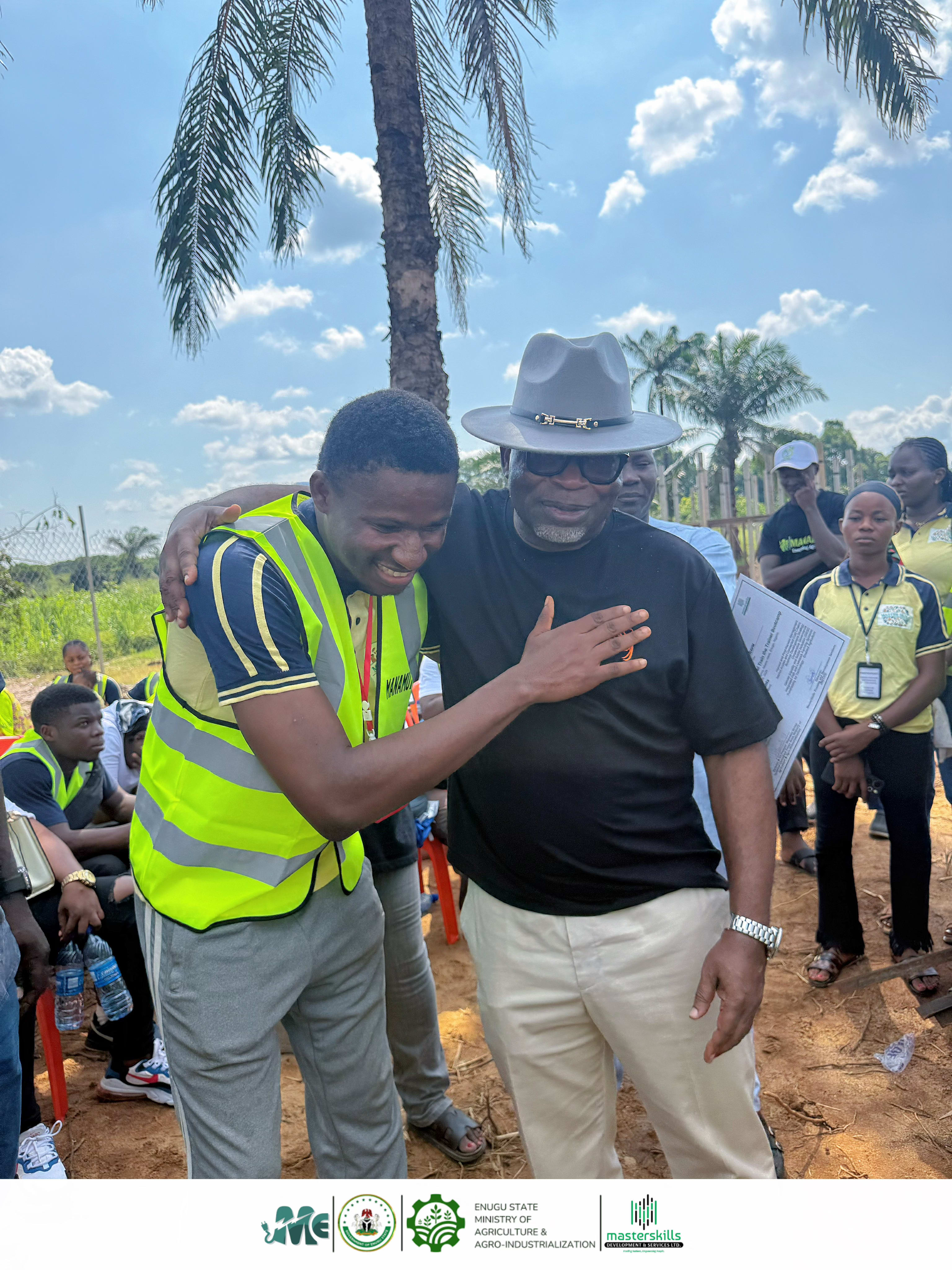 Rt. Hon. Toby Okechukwu and Dr. Patrick Ubru with persons with disabilities