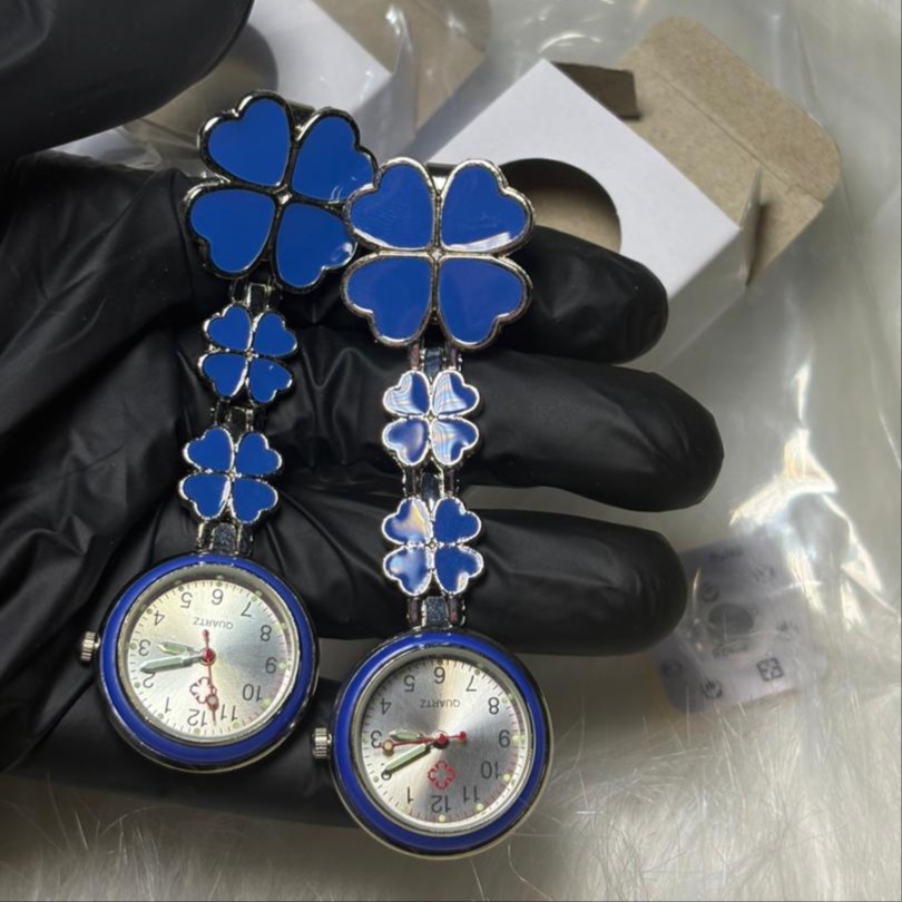 Breast watch & Nurses brooch