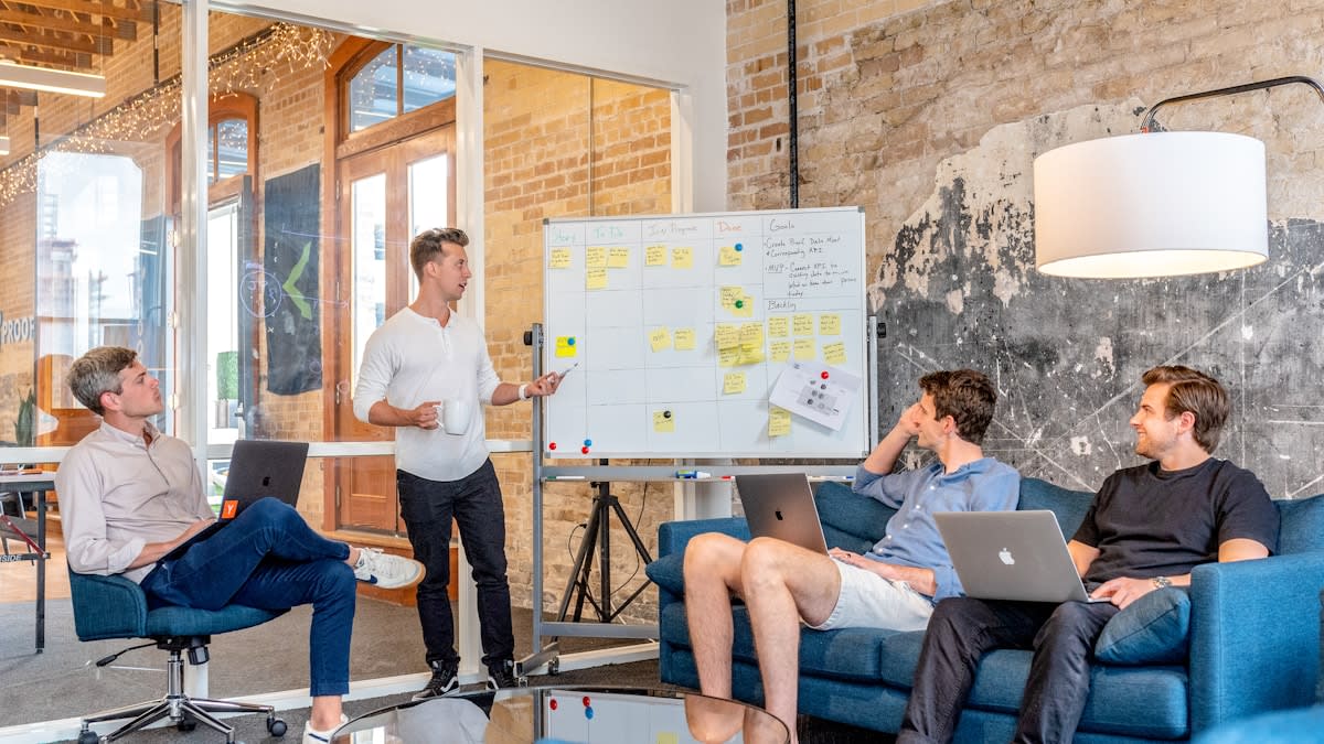 AI presentation builder for slide decks, pitches, and visual documents Business presentation meeting with laptop and slides for AI generated pitch decks