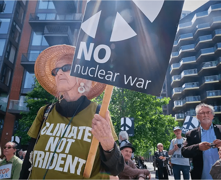 Climate activists protesting with signs