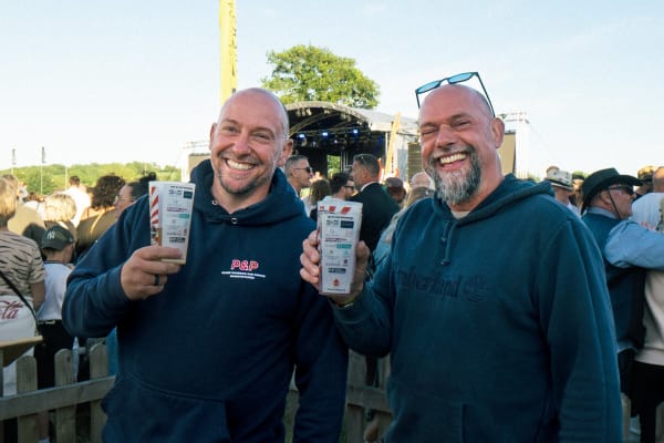 Two festival-goers laughing, Home Farm Fest 2026
