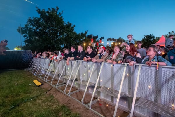 Crowd at the barrier in the evening, Home Farm Fest 2026