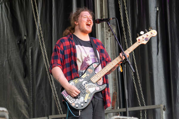 Performer singing on stage, Home Farm Fest 2026