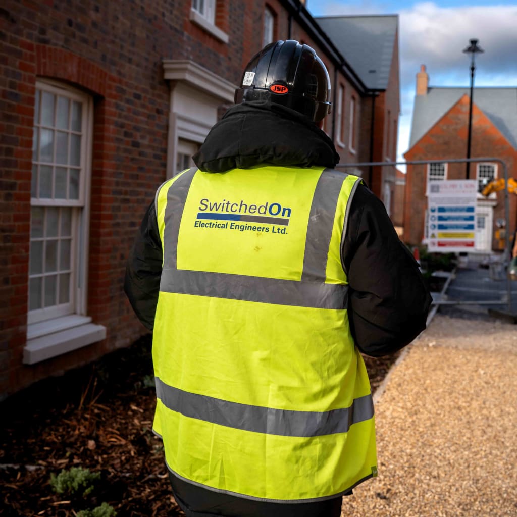 Rear-branded hi-vis portrait captured on-site for monthly trades retainer continuity. in Dorset