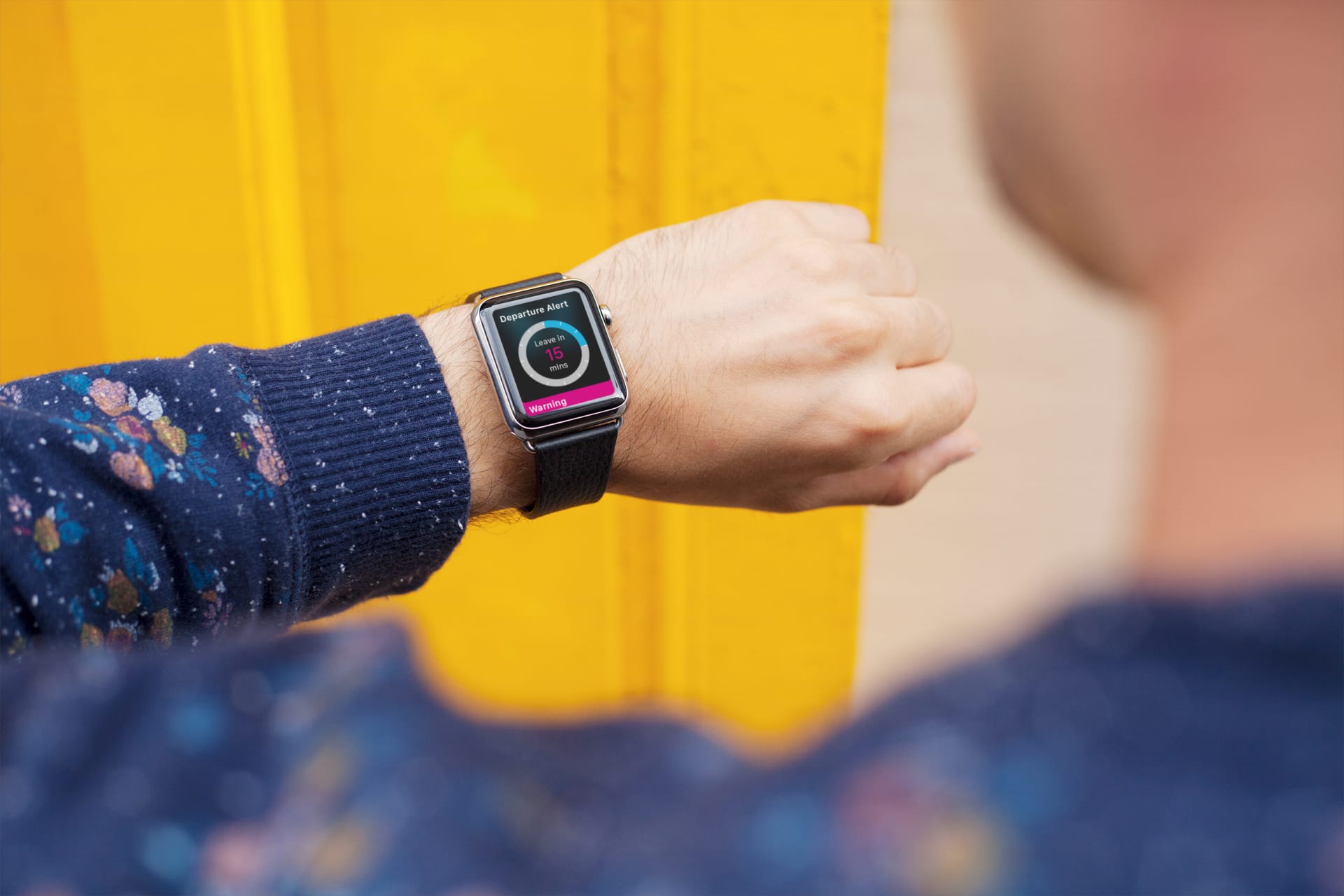 beauty shot of a man wearing an Apple Watch that is showing a key screen