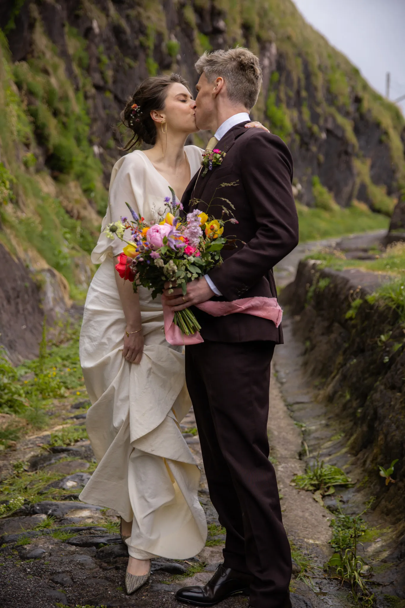 Bride and Groom embracing in a scenic location
