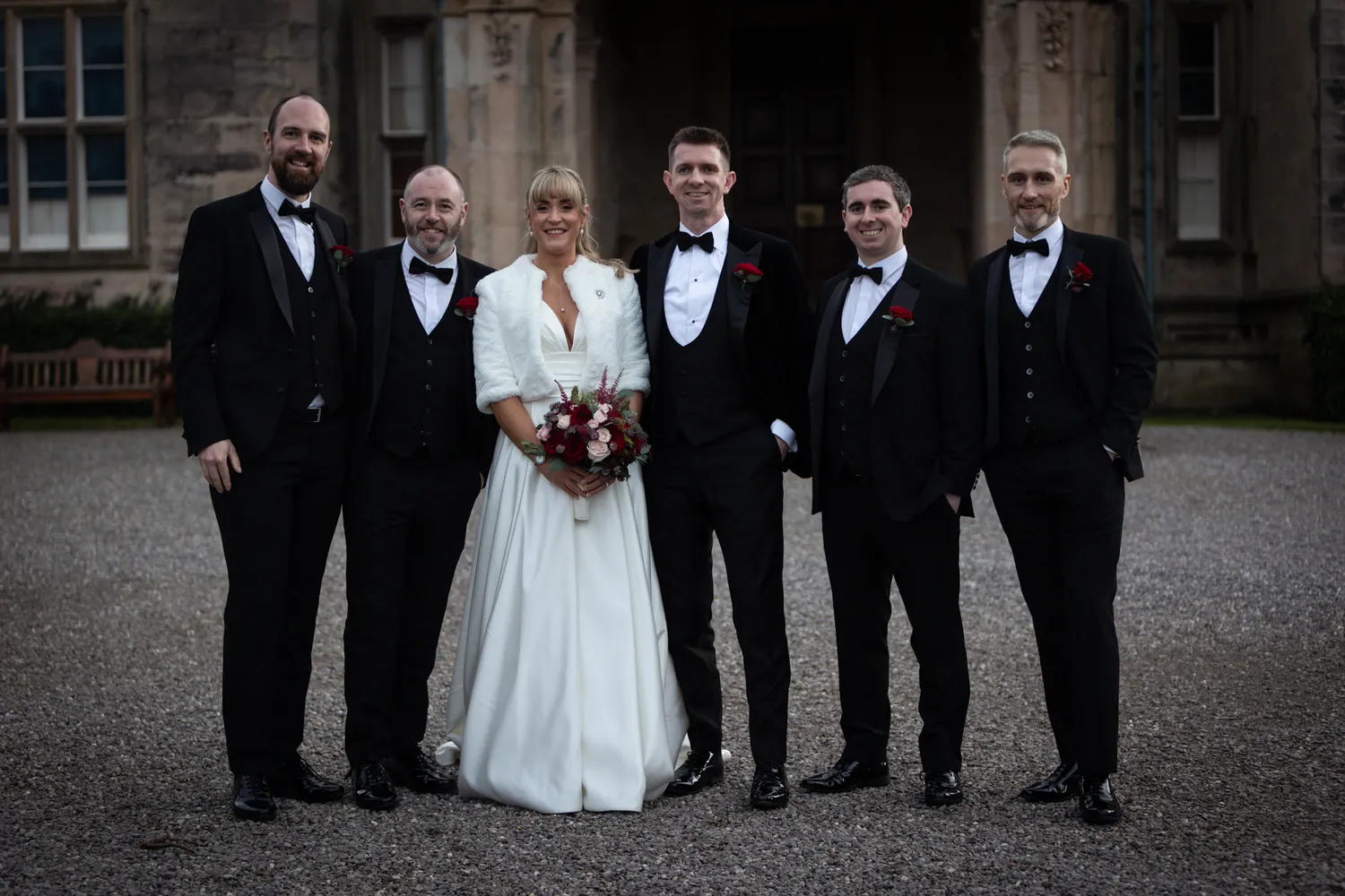 Bride, Groom and Groomsmen outside the church