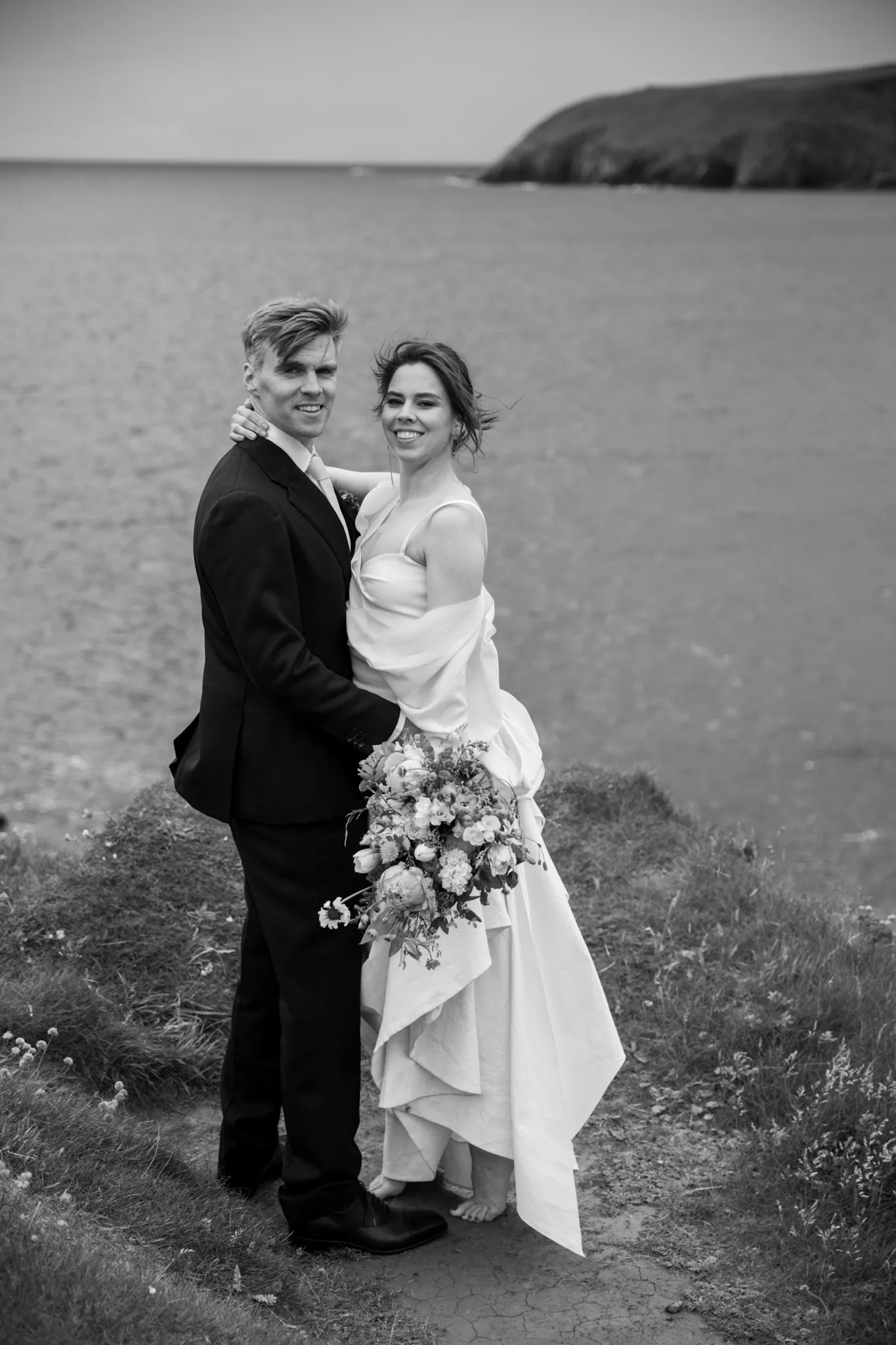Bride and Groom embracing in a scenic location