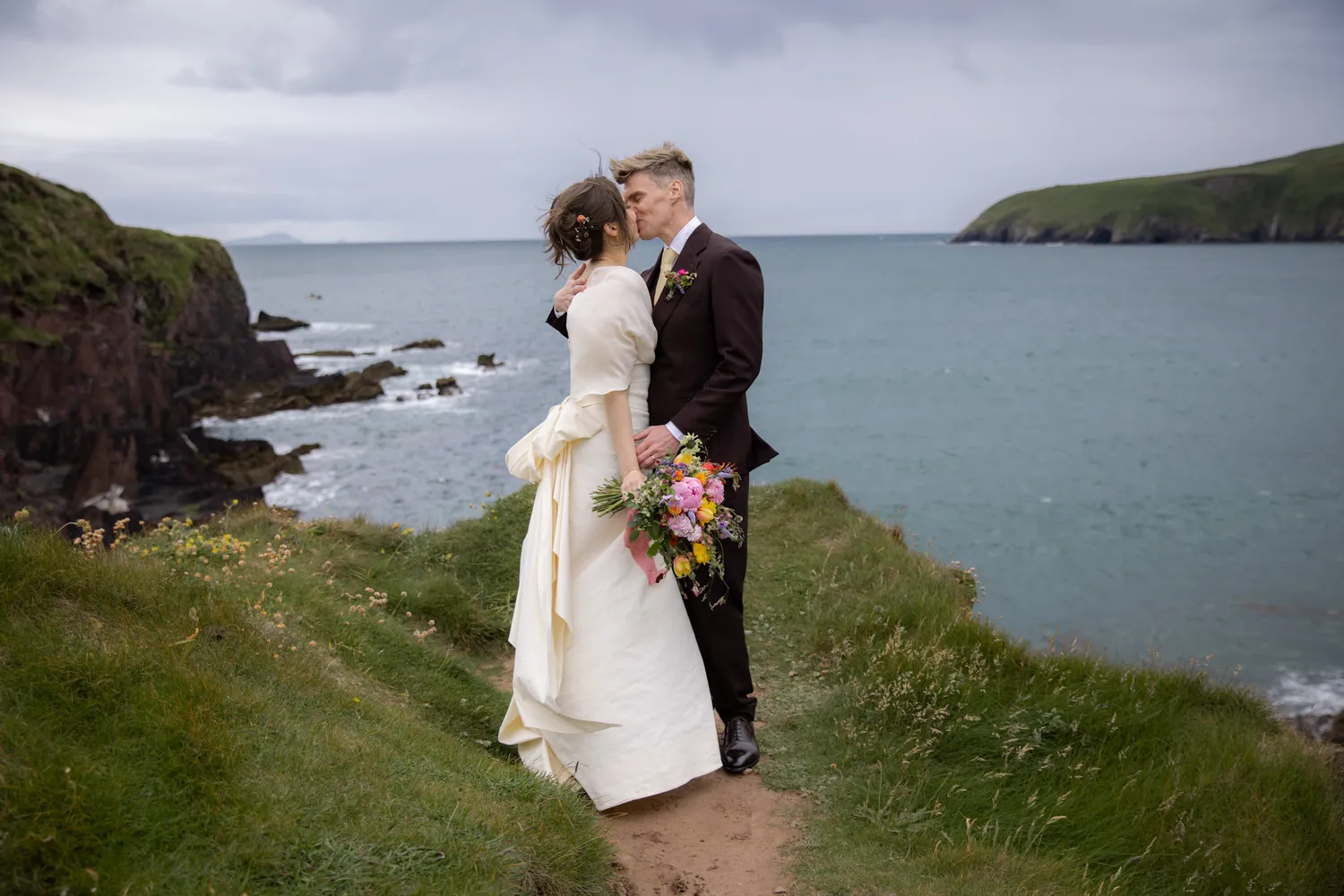 Bride and Groom embracing in a scenic location